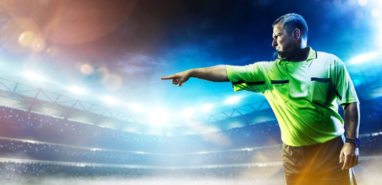 Professional soccer referee on the grand arena